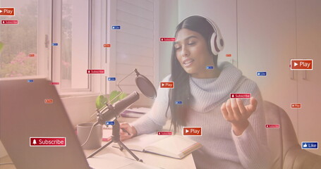 Recording content creator talking at office desk with laptop mic showing Play Subscribe Like icons
