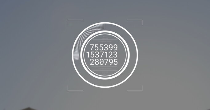 Showing digital circular interface with progress arc, readouts and corner markers on grey backdrop