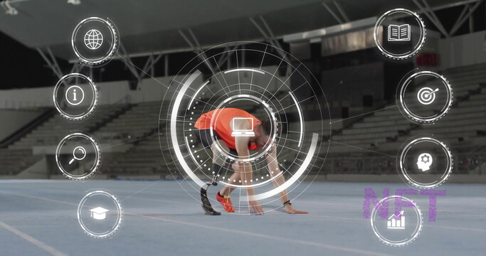 Crouching male athlete in orange top tracker initiating sprint on track with starting blocks, HUD