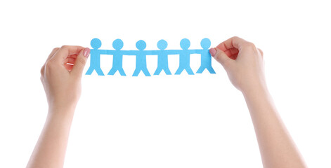 Woman holding paper figures of people on white background, closeup