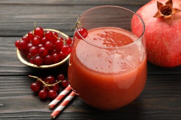 Superfood. Tasty smoothie in glass and ingredients on wooden table, closeup