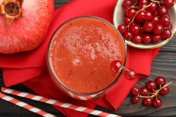 Superfood. Tasty smoothie in glass and ingredients on wooden table, flat lay