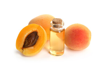 Bottle of essential oil and fresh apricots isolated on white