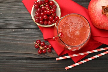 Superfood. Tasty smoothie in glass and ingredients on wooden table, flat lay. Space for text