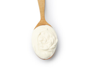 Delicious sour cream in spoon isolated on white, top view