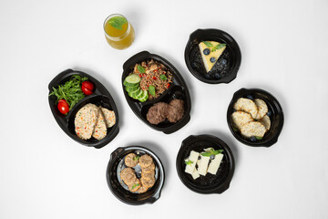 Set of ready-made meals for healthy eating on a white background