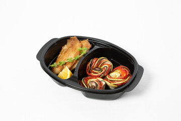 Chicken breast in batter with grilled vegetables on a plate on a white background