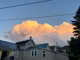 Clouds over the city in the evening sky
