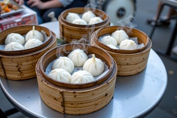 Steaming Delicious Dumplings: Freshly steamed dumplings, displayed in bamboo steamers on a rustic metal table. The steam rising from the hot food evokes warmth and anticipation.