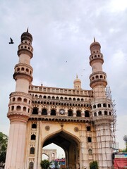 Fototapeta premium Hyderabad, India, 2 Nov 24:The majestic Charminar, a symbol of Hyderabad, India, stands tall against a cloudy sky. Its intricate architecture and four minarets offer a timeless view of the city's rich