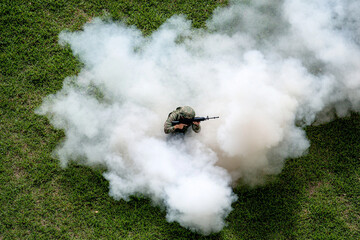 Dramatic battlefield under dense smoke and debris during conflict