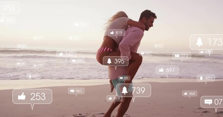 Woman jumping on partner back, piggybacking along sunset beach with social media alerts growing