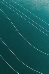 Abstract teal and white curved lines pattern background