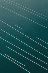 Abstract teal background with diagonal white lines and subtle gradients