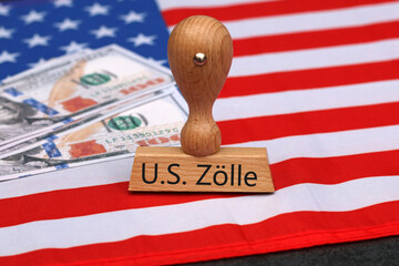 A stamp with the inscription U.S. Tariffs on an American flag.