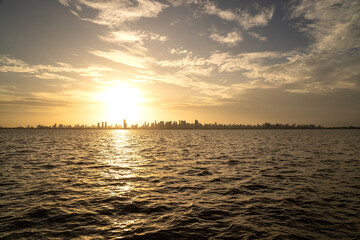 Belém city skyline buildings and Amazon River on a sunny summer day during sunset. Concept of environment, ecology, biodiversity, climate change, global warming, travel, tourism.