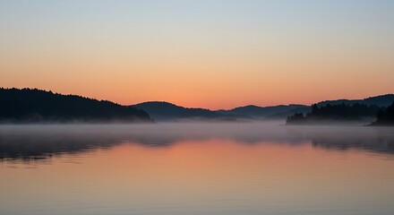 Obraz premium scene of a calm body of water reflecting a subtle, hopeful sunrise on New Year's Day. Distant, silhouetted trees or mountains line the horizon, adding depth. The water is perfectly still,