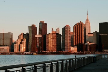 Manhattan’s Sunlit Skyline From the Boardwalk (Queens, New York, USA)