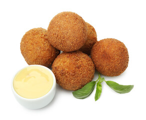 Delicious fried croquette balls, sauce and basil isolated on white