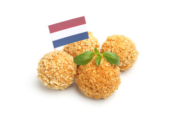 Delicious fried croquette balls, basil and small flag of Netherlands isolated on white