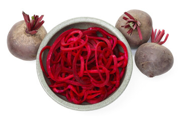 Raw beetroot noodles and fresh vegetables isolated on white, top view. Vegetarian dish