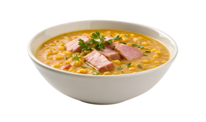 Hearty bowl of split pea soup with ham chunks and fresh parsley isolated on transparent background