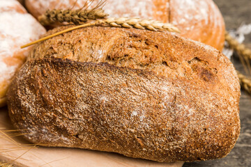 Homemade natural breads. Different kinds of fresh bread as background, perspective view with copy...