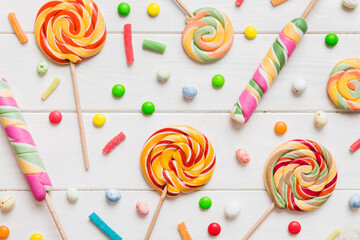 Tasty appetizing Party Accessories Happy Birthday Sweet. Different types of candies on colored...