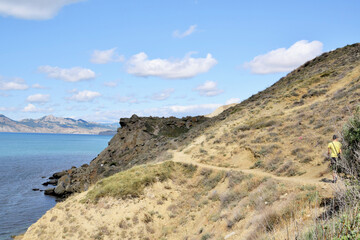 Travel and recreation. Road through the mountainous terrain along the sea coast