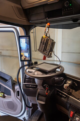 Updating the software of a truck's tachograph at an authorized service center, required for all newly installed smart tachographs.