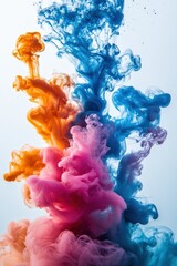 An artistic shot of vibrant blue and orange ink swirling in water. The dynamic mixing of colors creates a beautiful, cloud-like explosion, evoking a sense of fluid motion and abstract art