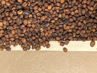 Brown paper on dark roasted  coffee beans background