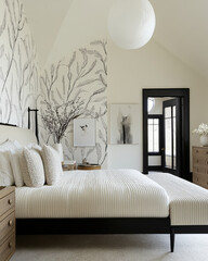modern bedroom featuring large bed with textured bedding, elegant wall art, and stylish light fixture. room has ambiance with natural light streaming in through large windows