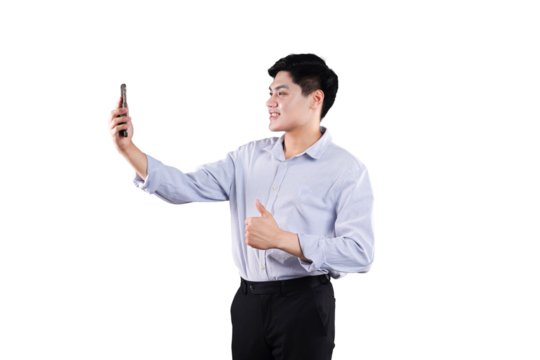 Selfie Success: A young professional man joyfully engages in a selfie session, displaying a cheerful smile and a thumbs-up gesture, capturing the essence of connectivity and modern communication.