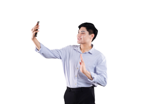 Vlogger Engaging with Audience: A cheerful man holding a smartphone, creating and broadcasting content with enthusiastic engagement.