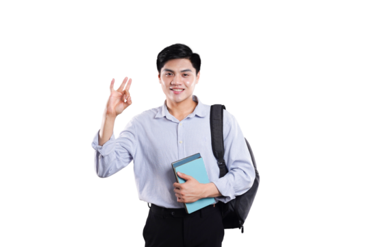 Happy student portrait: A cheerful student stands confidently, holding a book and giving a gesture of approval, embodying optimism and readiness for academic success.