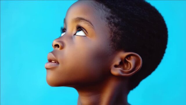 Boy with serious expression looking straight ahead