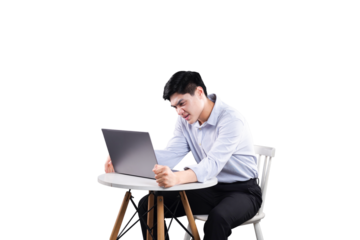 Frustrated man with Laptop: A man exudes palpable frustration while intently focused on his laptop, depicting the struggles of modern technology, deadlines, or digital challenges.