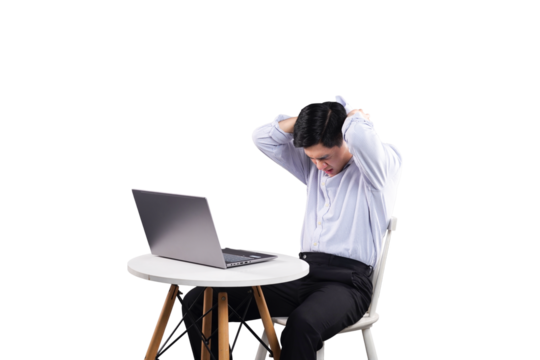 Frustrated Man and Laptop: A man, desk, chair, laptop. A moment of frustration. The person struggles to understand or get work done, and this demonstrates stress. 
