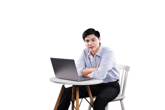 Focused professional working on laptop: A focused man sits attentively, using a laptop while sitting at a small round table. The scene evokes a sense of concentration and a modern workspace.