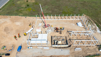 Aerial View of Construction Site with Cranes