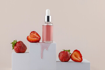 Dropper bottle on a white podium with strawberries on a beige background. Presentation of skin care products.