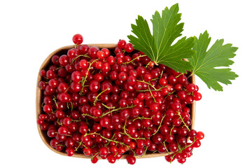 Red currants in a wooden bowl with green leaves, isolated on transparent background, PNG