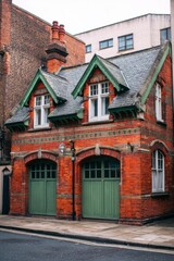 Fototapeta premium Beautiful old brick building with a unique design located on a quiet street, showcasing green accents and charming architecture in the heart of the city during early morning light