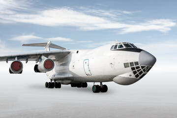 White wide body transport freight airplane isolated on bright background with sky