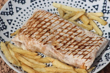 French tacos and french fries close up