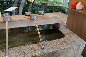 ablution sink in a shinto temple (shrine) in tokyo in japan 