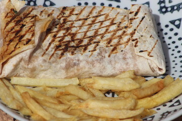 French tacos and french fries close up