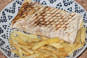 French tacos and french fries close up