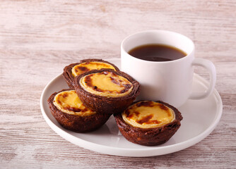 Chocolate custard cakes with cup of coffee